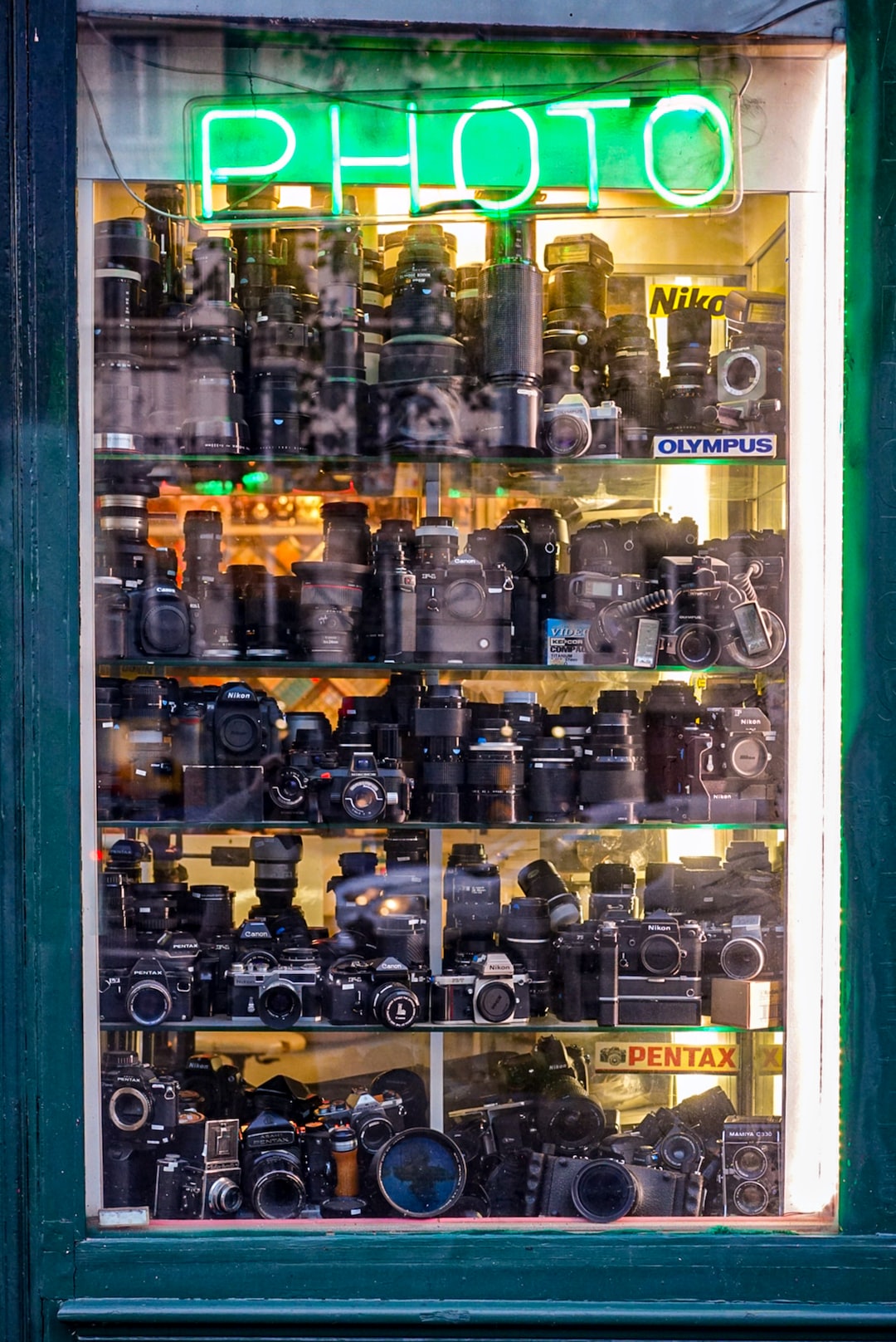 vintage cameras in display cabinet