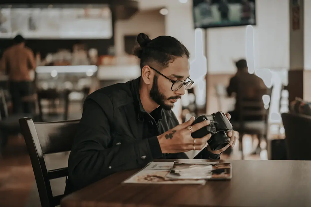 man in black leather jacket wearing black framed eyeglasses