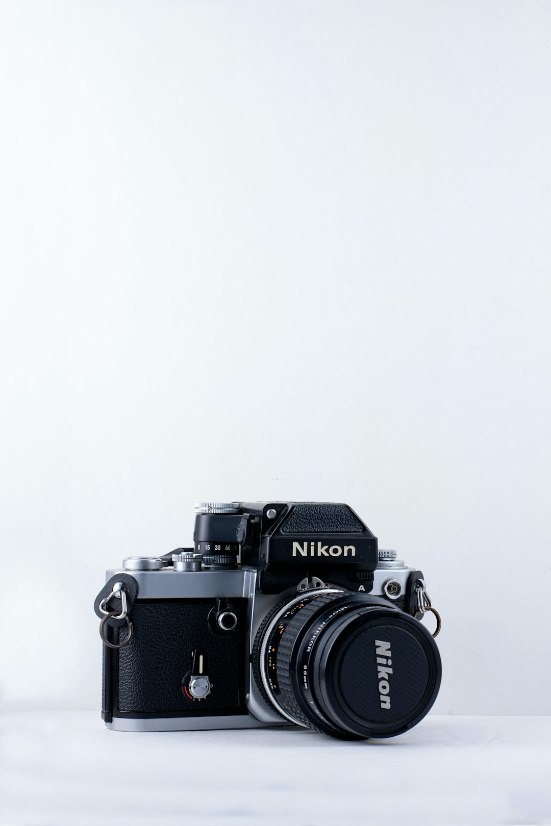 black Nikon camera against white background