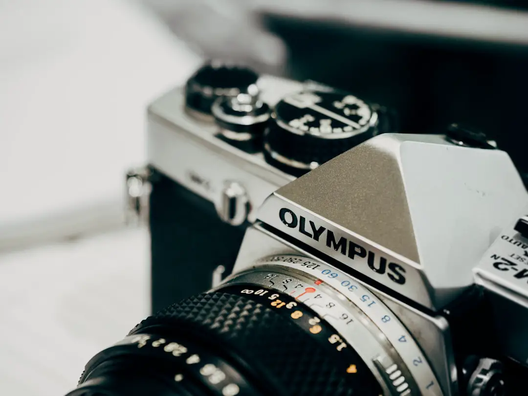 closeup photography of black and gray Olympus camera