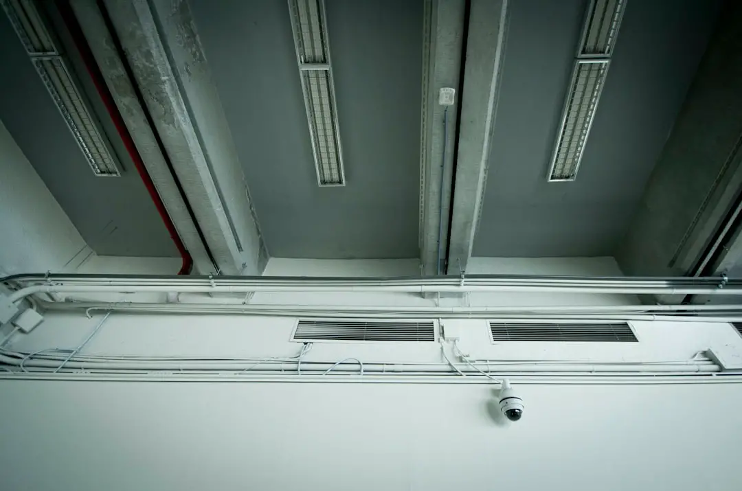 white CCTV camera on white wall