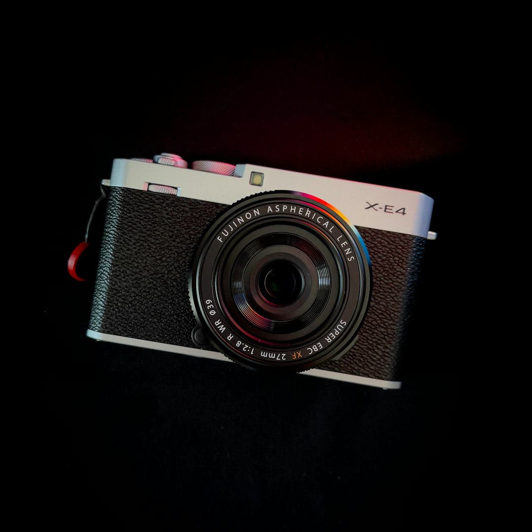 black and silver nikon point and shoot camera