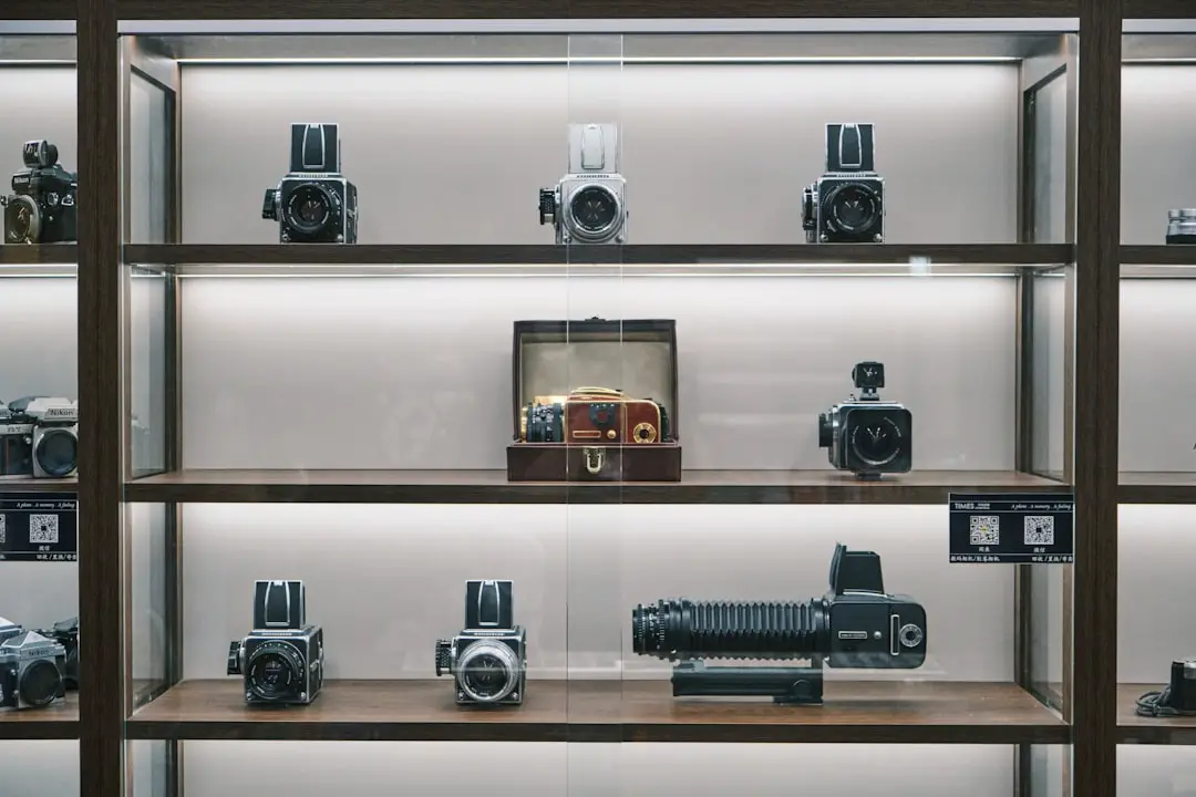 A display case filled with lots of different types of cameras