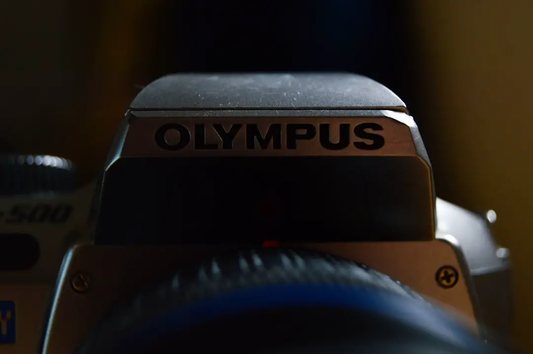 An olympus camera is featured up close.