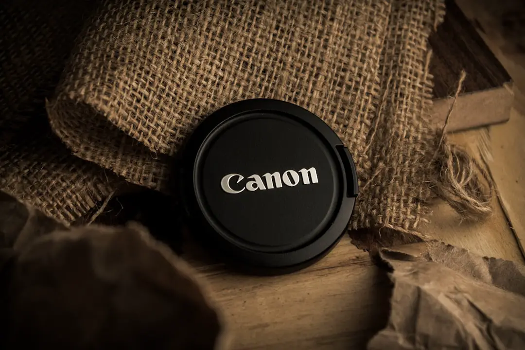 a black lens cap sitting on top of a wooden table