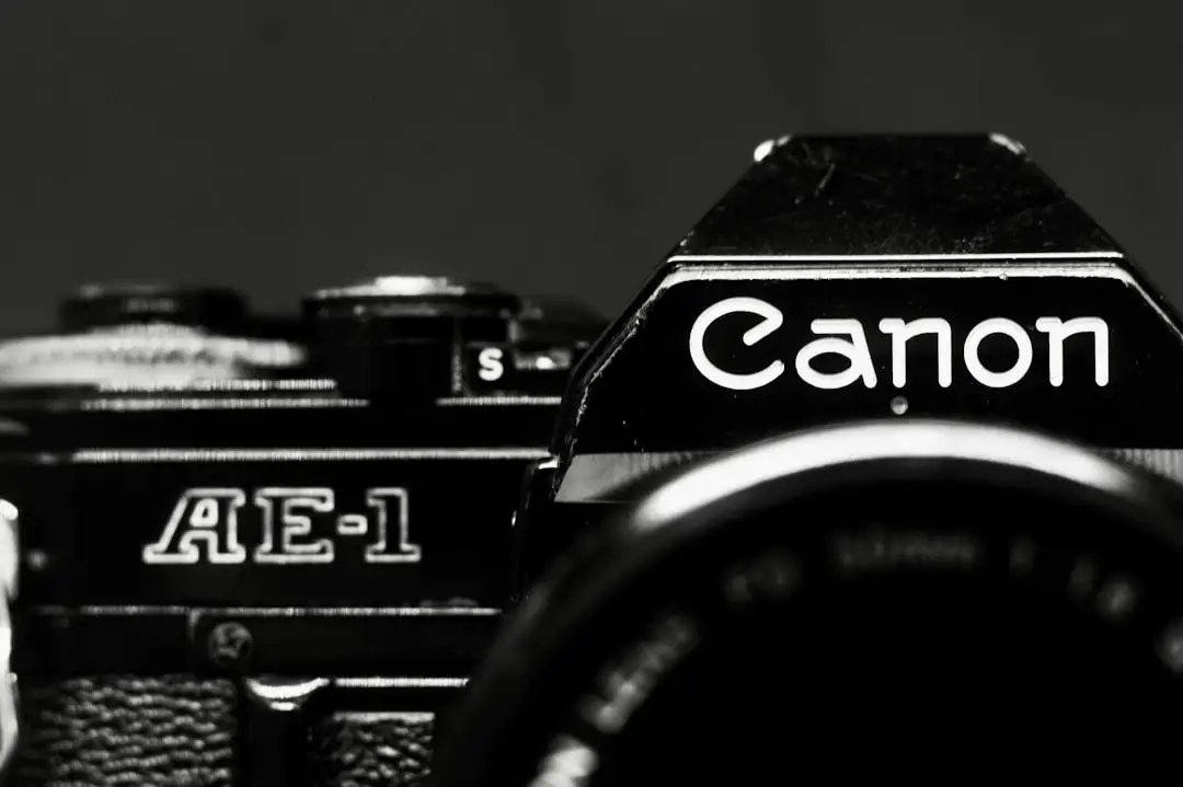 A black and white photo of a canon camera